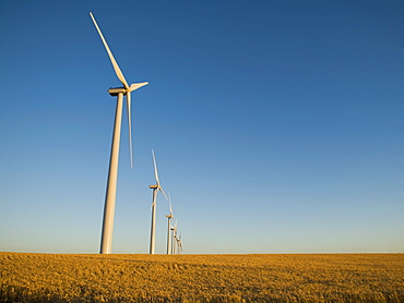 Row of windmills on wind farm