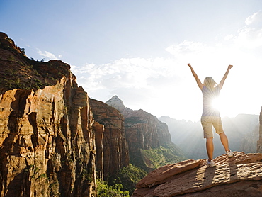 A woman standing at an apex at Red Rock