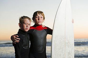 Children posed with surfboard