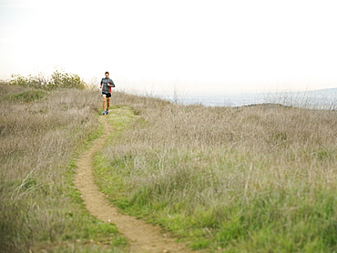 Person running on trail