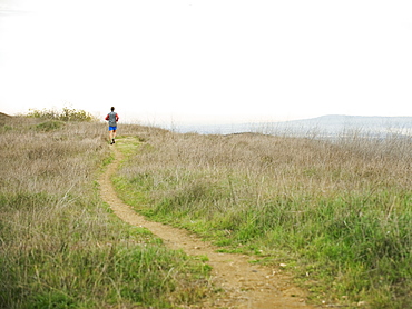 Person running on trail