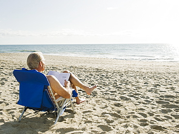 Man relaxing in beach chair