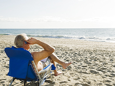 Man relaxing in beach chair