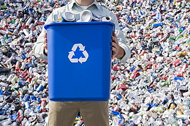 Man holding blue bin