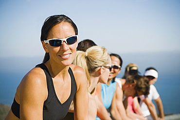 Runners resting on the side of the road