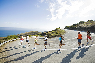 Runners on a road in Malibu