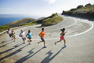 Runners on a road in Malibu