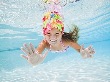 Girl (8-9) swimming underwater