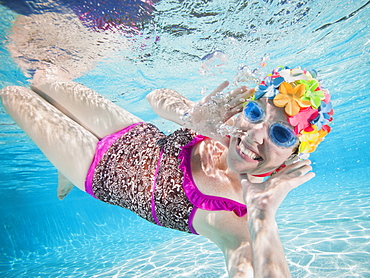 Girl (8-9) swimming underwater