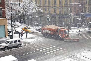 Snowplow on street, New York City