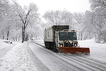 Snowplow on street, New York City