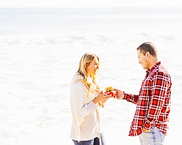 Man giving woman present