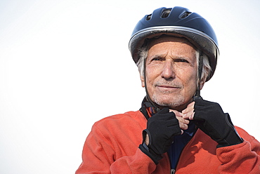 Close up of senior man in biking helmet