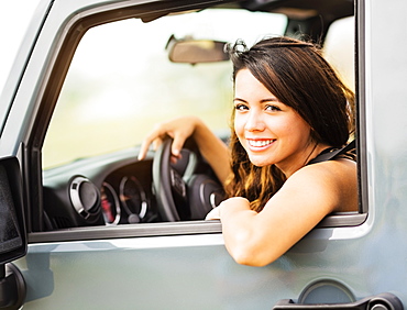 Portrait of young woman during road trip