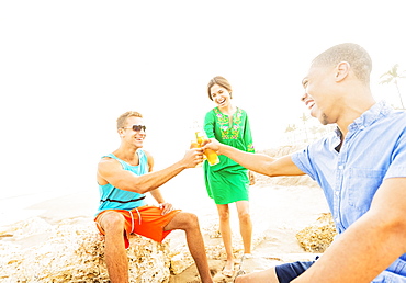 Young people drinking beer on beach, Jupiter, Florida