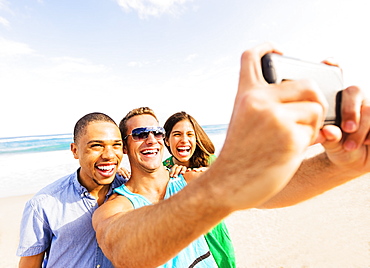 Young people taking selfie on beach, Jupiter, Florida