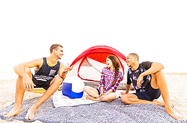 Young people relaxing on beach