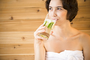 Woman drinking water in spa