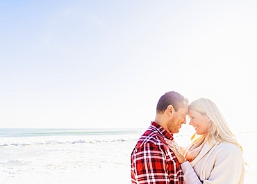Smiling couple on beach, Jupiter, Florida