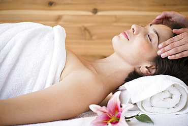 Woman receiving massage in spa