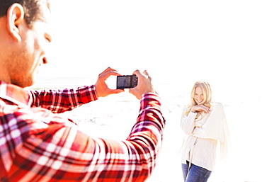 Man taking picture of woman