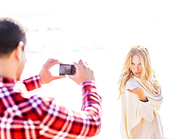 Man taking picture of woman