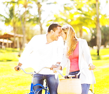 Couple riding on bikes, Jupiter, Florida