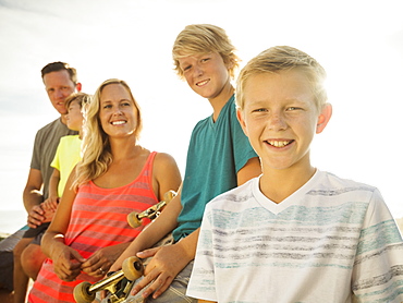 Portrait of with three children (6-7, 10-11, 14-15) on vacation