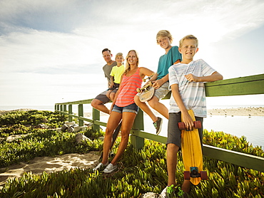 Portrait of family with three children (6-7, 10-11, 14-15) on vacation, Laguna Beach, California