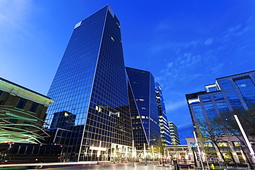 Low angle view of city street with glass skyscrapers, Canada