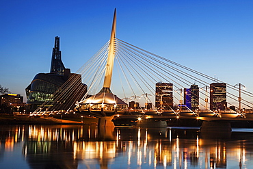 Canadian Museum for Human Rights and Esplanade Riel bridge at dusk, Winnipeg Manitoba, Canada