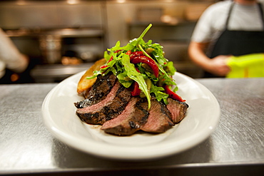 Sliced steak with salad