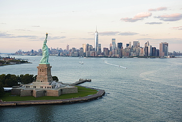 Aerial view of Statue of Liberty and city skyline, New York, New York