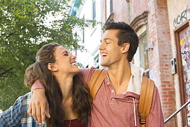 Young couple walking on street, Brooklyn, New York