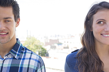 Young couple looking sideways, Brooklyn, New York