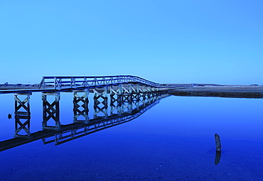 Bridge reflecting in water, blue image, Sandwich, Cape Cod, Massachusetts