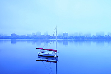 Charles River with boat shrouded in fog, Charles River, Boston, Massashusetts,USA