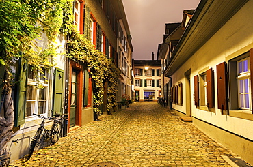 View along illuminated old town street, Basel, Basel-Stadt, Switzerland