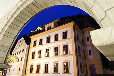 Liechtenstein National Museum seen through arch, Liechtensteinisches Landesmuseum and Vaduz Castle - Vaduz, Liechtenstein