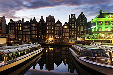 Boats in canal at sunrise, Amsterdam, North Holland, Netherlands