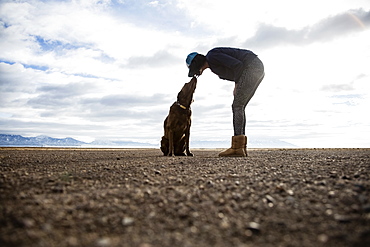 Woman with dog outdoors, Colorado, USA