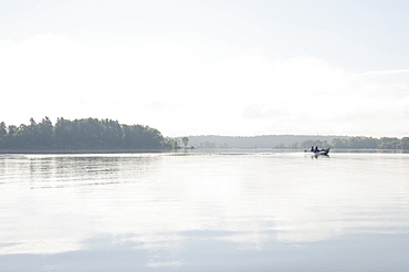 People traveling in boat on lake, Morristown, New York,USA