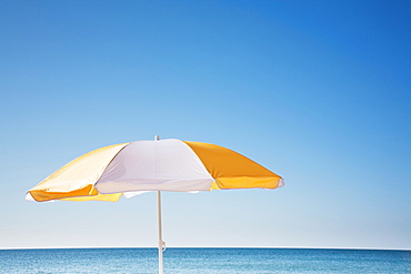 Beach umbrella by sea, Nantucket, Massachusetts, USA