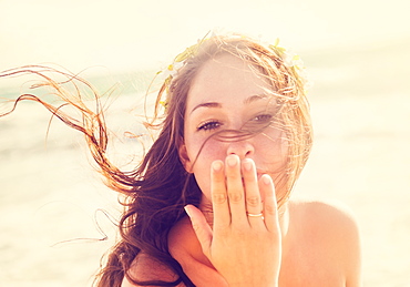 Woman throwing a kiss on beach, Jupiter, Florida,USA