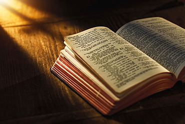 Close up of open Bible on table