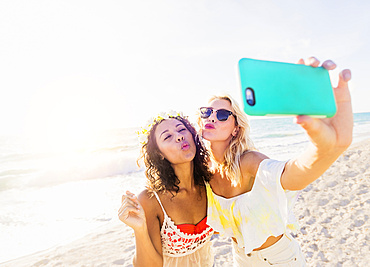 Female friends taking selfie on beach, USA, Florida, Jupiter