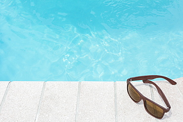 Sunglasses on pool side