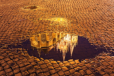 Reflection of Erfurt Cathedral in puddle, Germany, Thuringia, Erfurt, Domplatz,Churches of St Severus,Cathedral of St. Mary Domberg