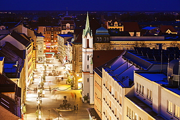 Illuminated old town street with tower of Schlosskirche, Germany, Brandenburg, Cottbus, Schlosskirche