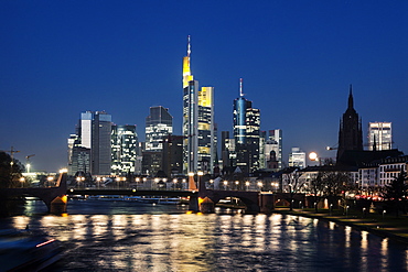 Illuminated riverfront skyline, Germany, Hesse, Frankfurt